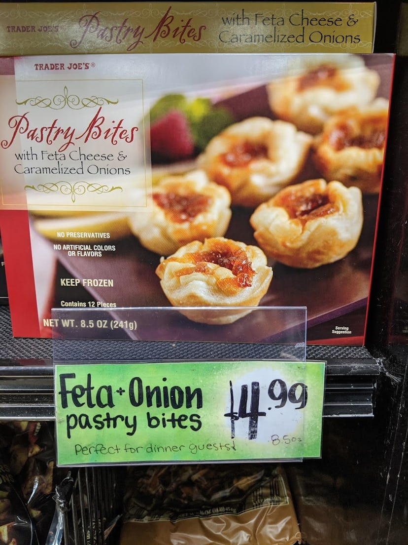 Trader Joe's display of packed, pre-made, frozen Pastry Bites with Feta Cheese and Caramelized Onion...