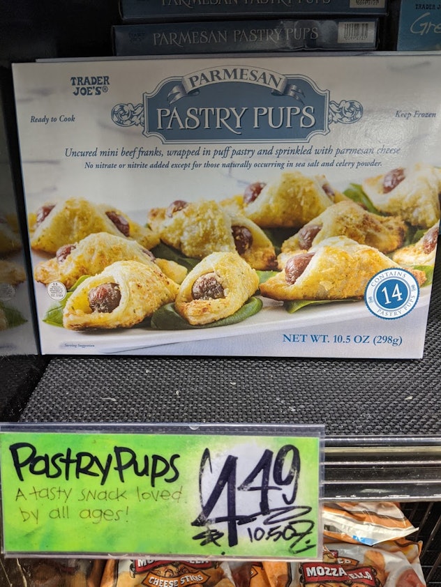 Trader Joe's display of packed, pre-made, frozen Parmesan pastry puffs
