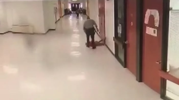 Surveillance footage caught a school resource officer slamming a student to the ground multiple time...