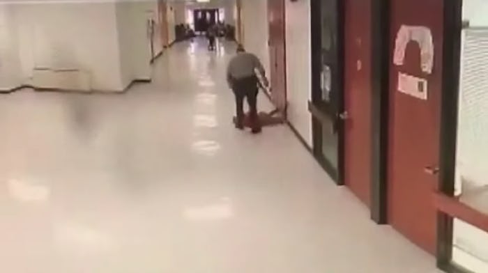 Surveillance footage caught a school resource officer slamming a student to the ground multiple time...