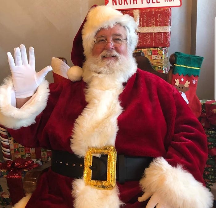 Santa Claus waves hello