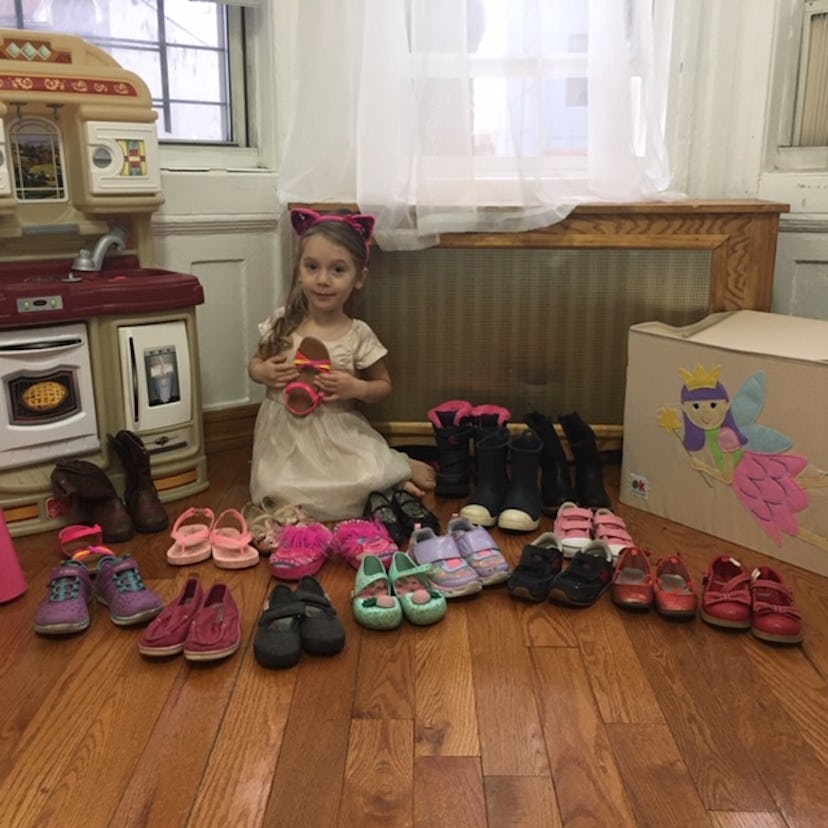 Child with many pairs of shoes