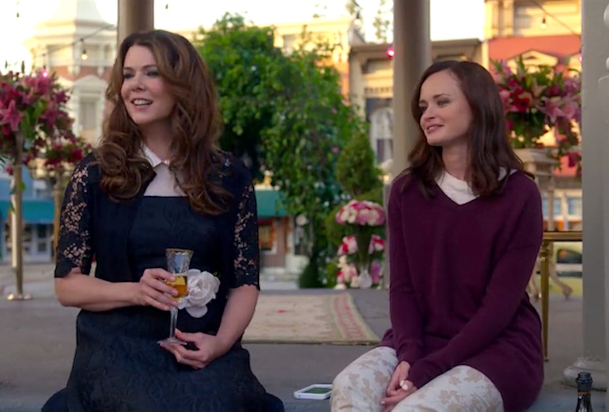 Rory and Lorelai Gilmore from 'Gilmore Girls' smile and sit on the steps of the gazebo in Stars Hollow.