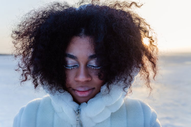 Young black woman in winter solar eclipse 2019