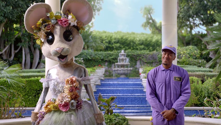 Nick Cannon and a contestant on 'The Masked Singer'