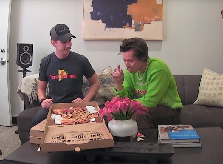 A screenshot from the video of Harry Styles pranking a pizza delivery guy.
