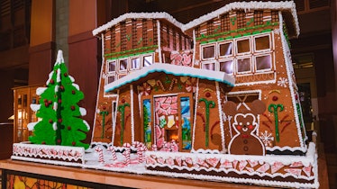 A giant gingerbread house with a Mickey gingerbread is on display at Disney's Grand Californian Hote...