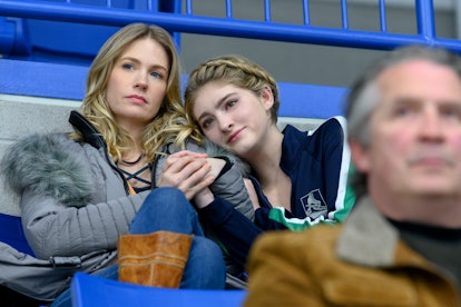 Carol (January Jones) and Serena (Willow Shields) watch Kat take the ice in Netflix's 'Spinning Out'
