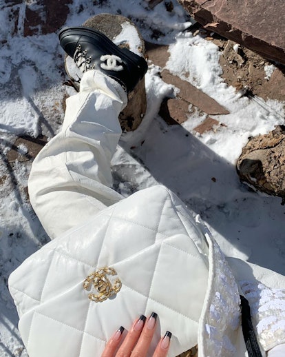 The Chanel Winter Boots Influencer Aleali May Swears By In The Snow