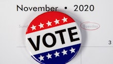 close up of patriotic campaign button on November 2020 calendar