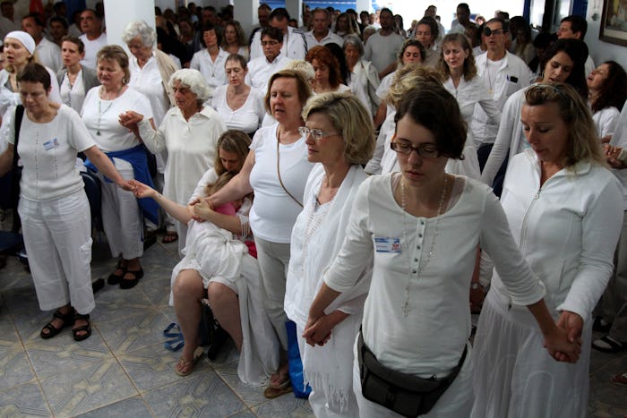 People pray together to prepare for a healing session at the "Casa de Dom Inacio de Loyola" in Abadi...