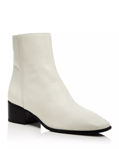 14 White Boots Outfits That Will Make You Want To Swap Out Your Go Tos