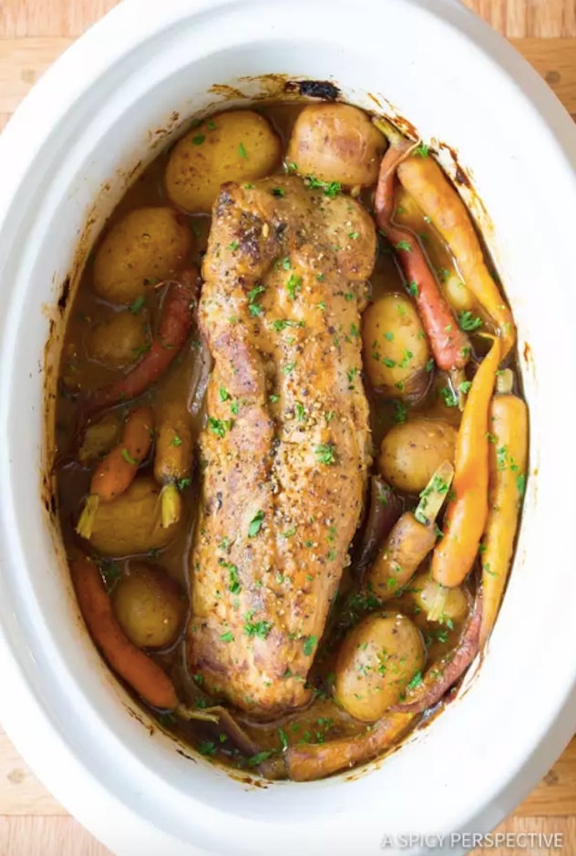 aerial view of pork loin with potatoes and carrots in sauce
