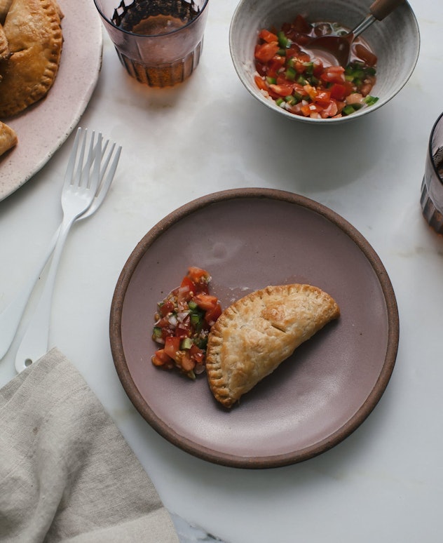 A baked empanada with beef filling is a perfect sheet pan recipe for kids.