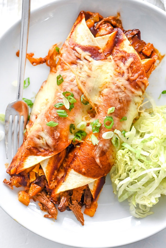 Sheet pan roasted squash and slow cooker beef make delicious enchilada filling.