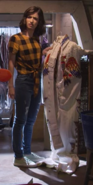 Ramona holding an Elvis Costume on Fuller House