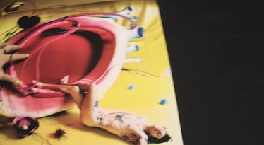 A shot from Harry Styles' 'Fine Line' album poster, featuring a photo of Harry Styles posing naked.