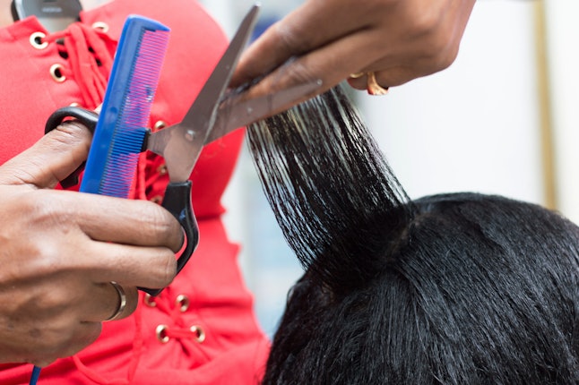 A person gets her hair done in a salon. The chemicals from hair relaxers and permanent dyes may contribute to causing breast cancer, especially among Black women, a new study says.