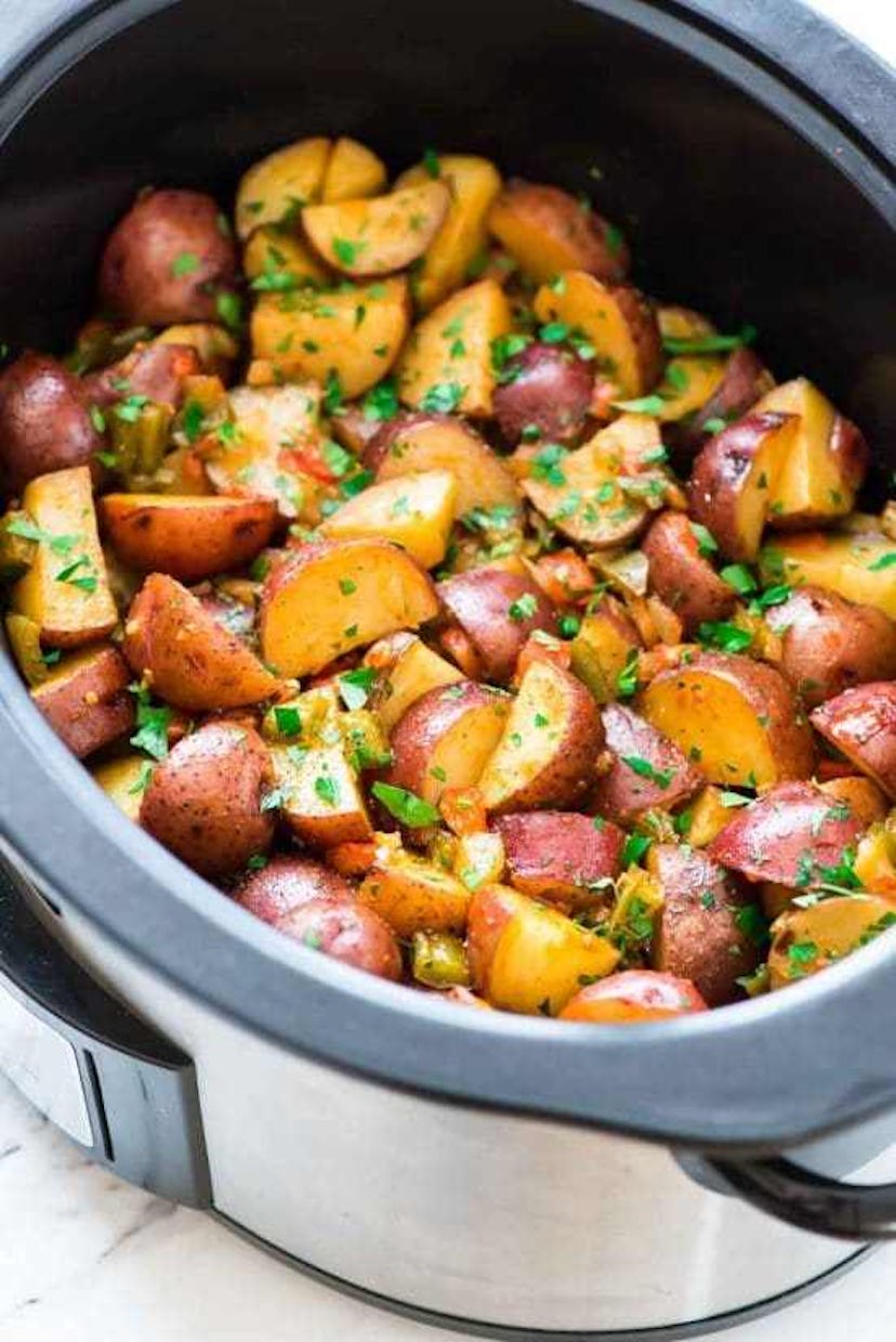 crock-pot full of chopped up seasoned potatoes
