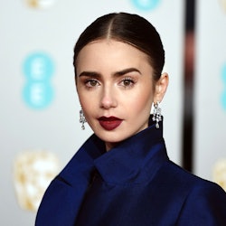 Lily Collins wearing a blue jacket paired with blue sequin skirt at the 2019 BAFTAs