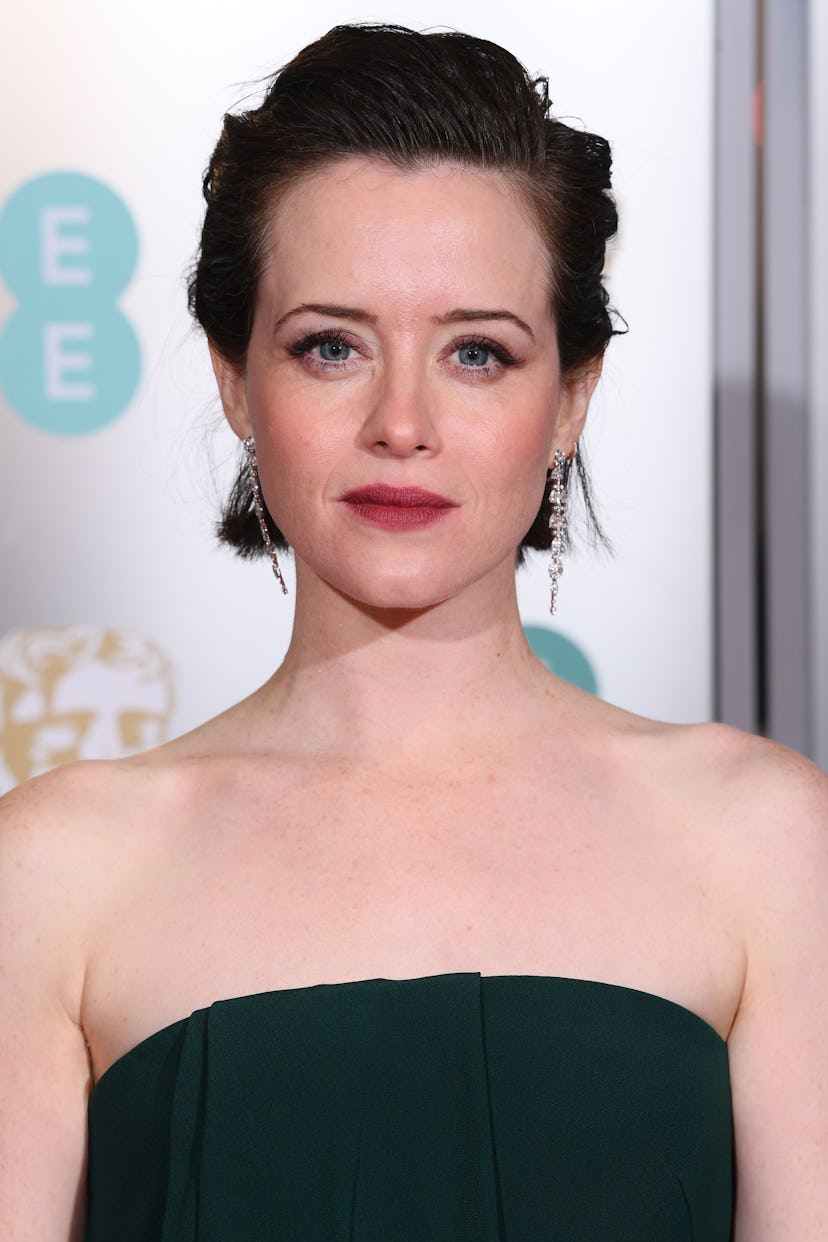Claire Foy with textured slick-back, wearing a black strapless gown at the 2019 BAFTAs