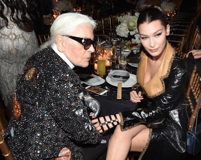 Bella Hadid sitting next to Karl Lagerfeld at the dinner party