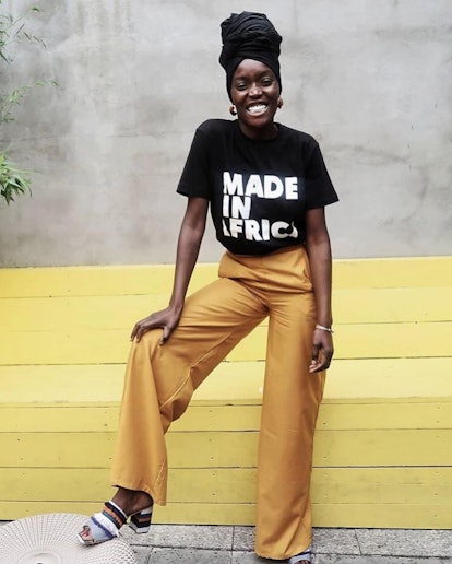 Influencer Folasade Adeoso posing for a photo in a black shirt with "made in Africa" text