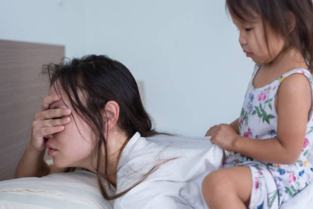 mom with daughter climbing on her back