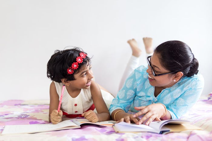 mom and daughter reading books on international women's day