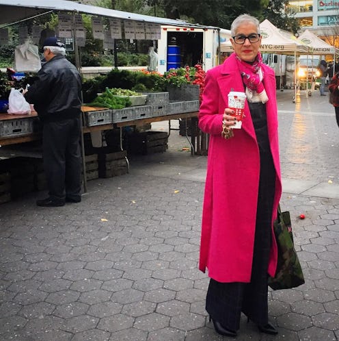 Jacqui Getz, the most stylish school principal in America, wearing a long pink coat and holding a cu...