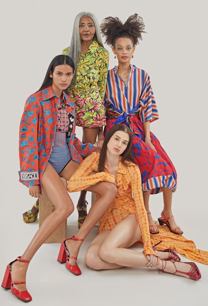 Four female models posing in colorful outfits consisted of skirts, dresses, tops, and bodysuits