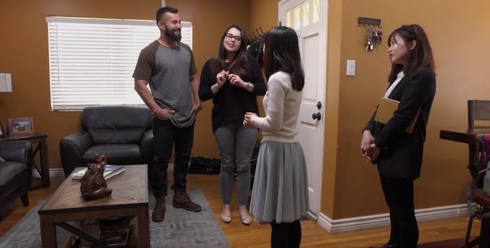 Four people standing in a house talking about Marie kondo's KonMari system