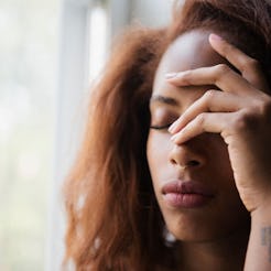 A woman experiencing a chronic headache 