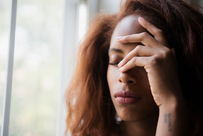 A woman experiencing a chronic headache 