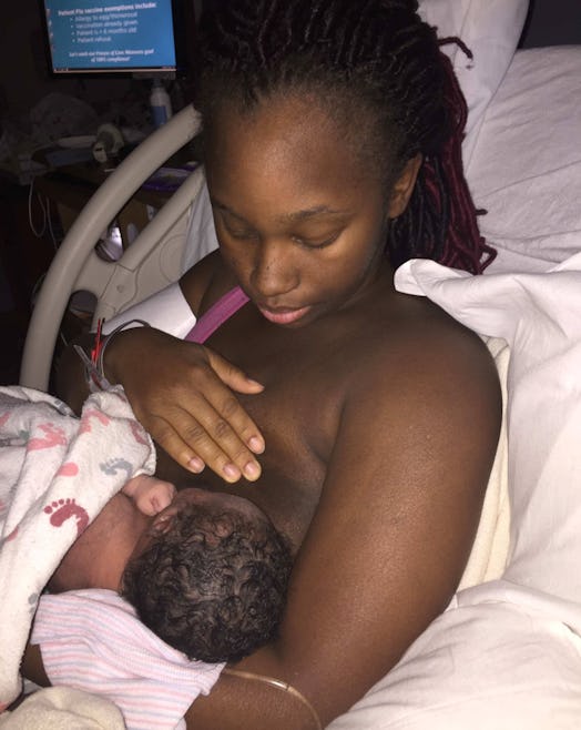 A woman breastfeeding her newborn in the hospital
