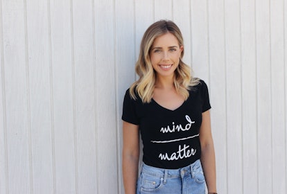 Sara posing in a black "mind matter" shirt