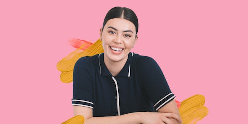 Lauren Chan, a Henning founder with an updo, wearing a polo shirt in front of a pink background