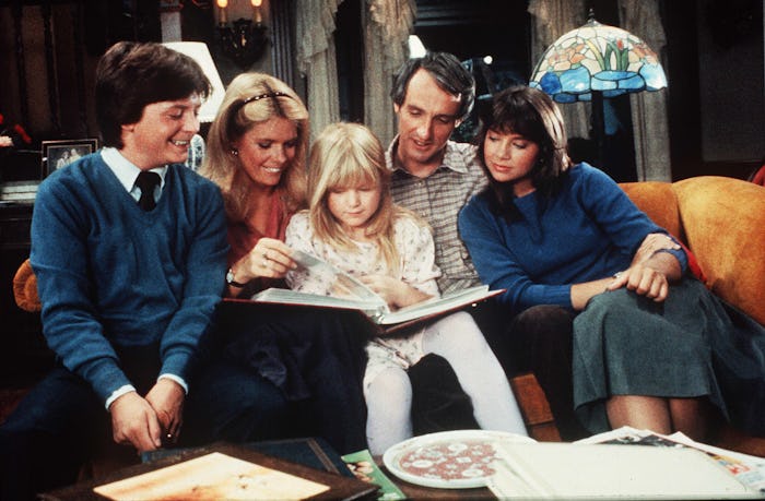 The Keaton family sitting on a couch in ‘Family Ties’