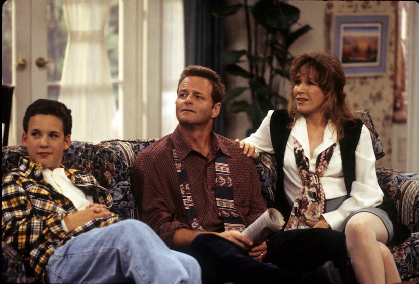 Cory, Alan, and Amy Matthews sitting on a sofa in "Boy Meets World"