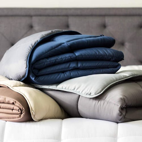 Three sets of bed sheets in grey, beige and blue 