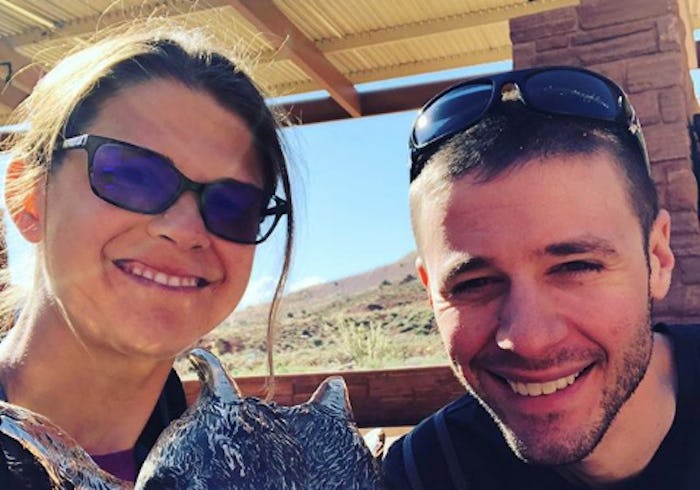 Jackie Noblett and her partner smiling and taking a selfie together on a sunny day