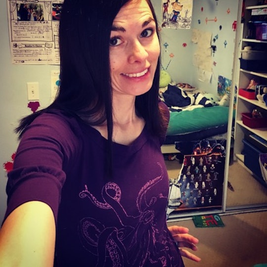 Brandy Ferner, who is parenting with a chronic illness, taking a selfie in a purple shirt