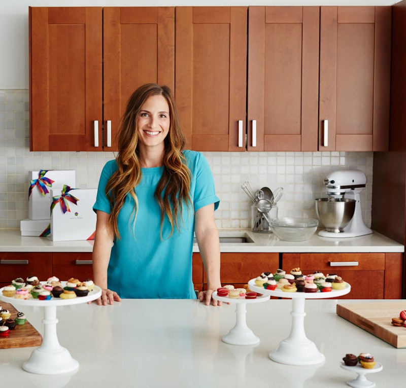 Melissa Ben-Ishay in her kitchen with her desserts displayed in front of her