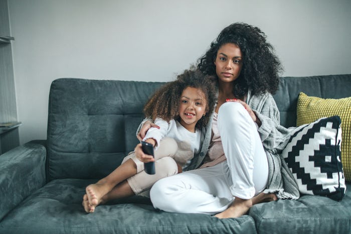 An empath mom cuddling with her child on the couch