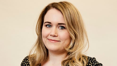 Bustle's editor Charlotte Owen in a black blouse with white dots