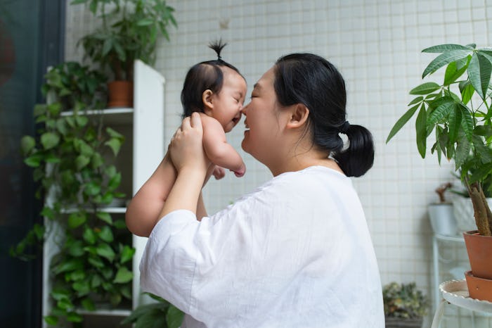 A mother holding her baby