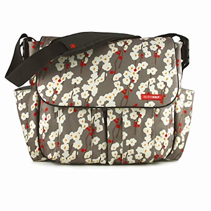 A grey bag with white flower drawings