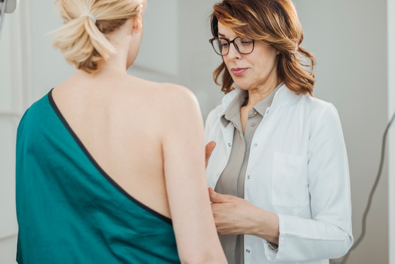 A woman getting a check up at an oncologist