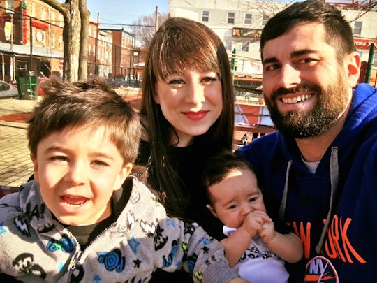 Romper's editor Danielle Campoamor with her husband and two kids.