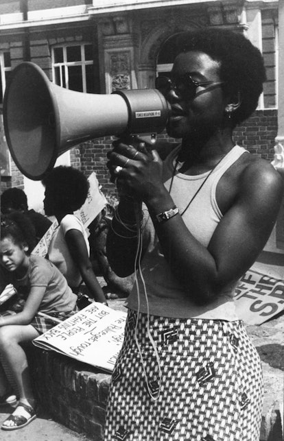 Black nationalist, activist, and community leader from Brixton Olive Morris with a megaphone